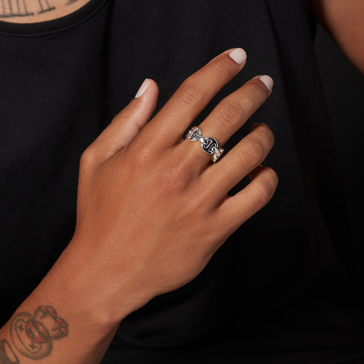 Classic Tri-Link ring in sterling silver, worn on the hand