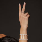 Classic Tri-Link Antiquated ring in 18K gold, shown with other pieces