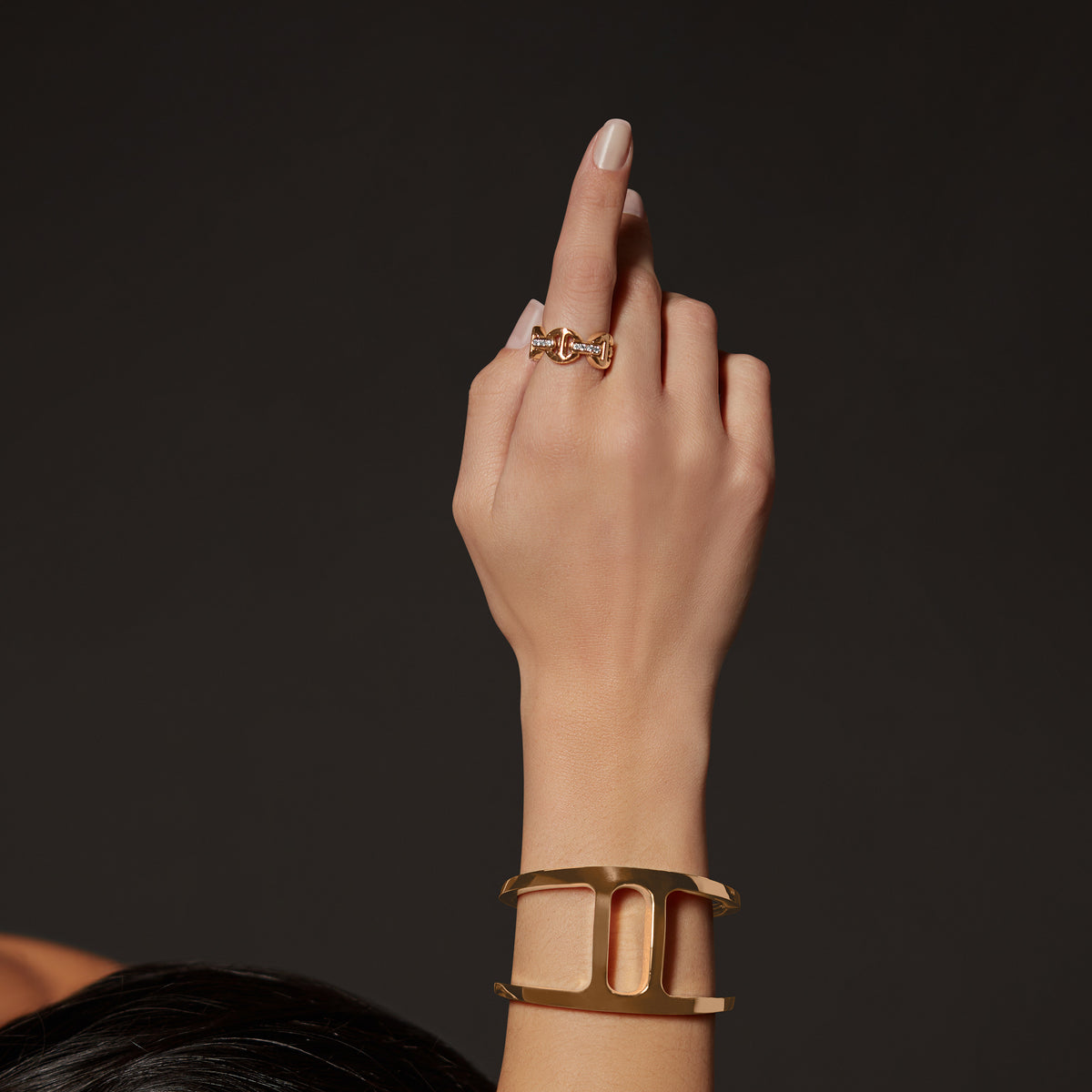 Classic Tri-Link with Diamond Bridges ring in 18K gold, shown with other pieces