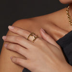 Dame Phantom ring in 18K gold, shown with other pieces