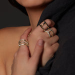 Dame Phantom with Diamonds ring in 18K gold, shown with other pieces