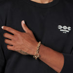10MM Open-Link™ Bracelet in 18K yellow gold, worn on the wrist
