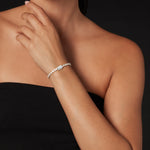 4mm Diamond Infinite Bracelet in 18K yellow gold, worn on the wrist