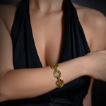 MMV Medium Link Bracelet with Emerald Bridges in 18K gold, worn on the wrist